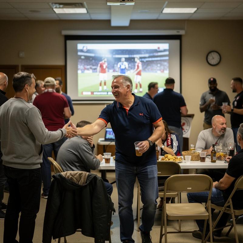 Two supporters greeting each other at an indoor football meetup